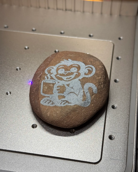 Monkey artwork engraved into a stone